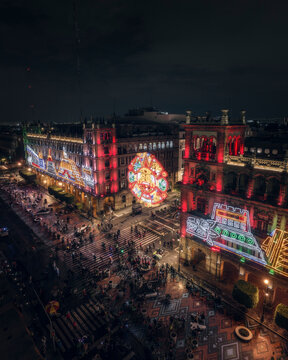 Aerial drone view of Zocalo with aztec society ornaments in Mexico City at night, Mexico.