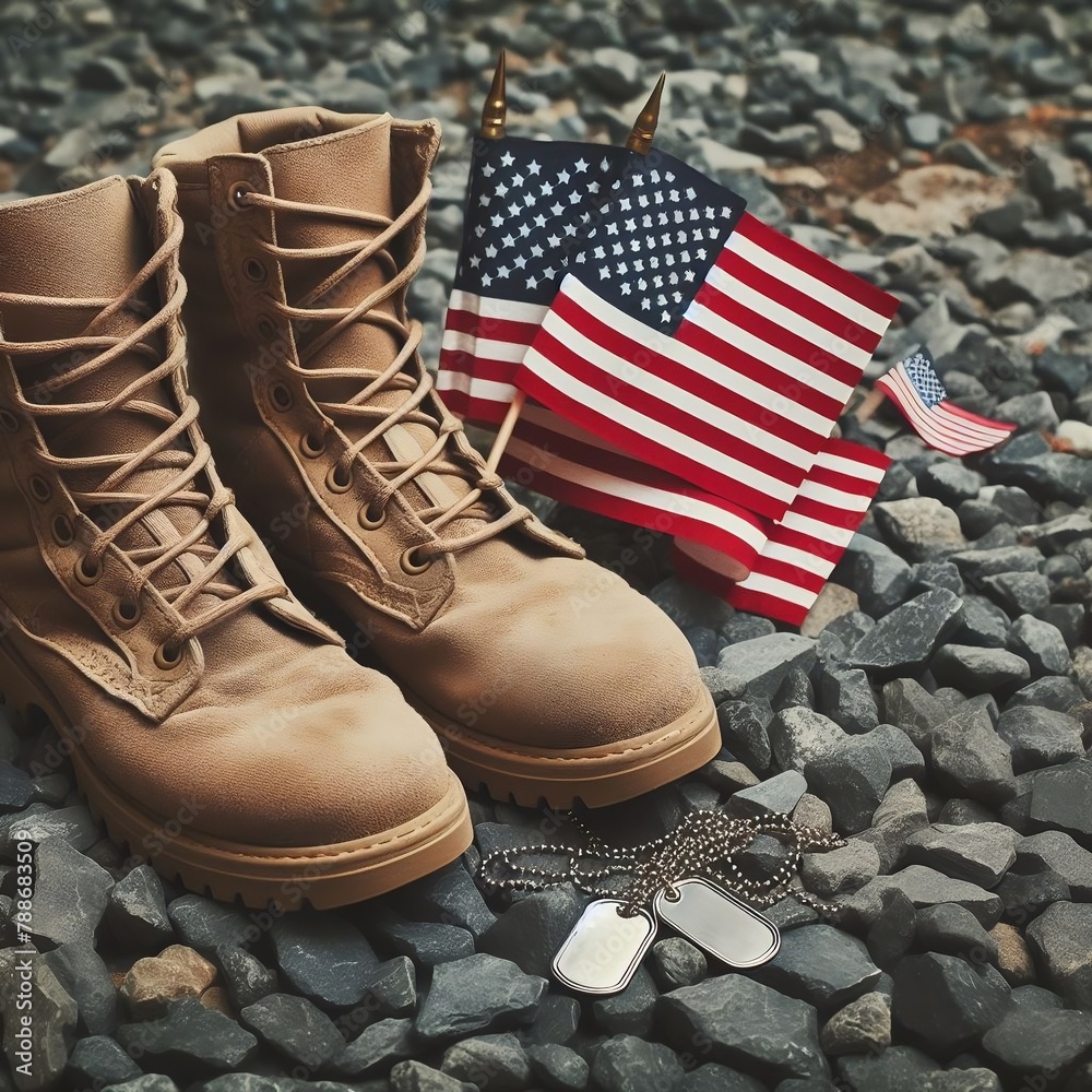 Wall mural Old military combat boots with dog tags and two small American flags. Rocky gravel background with copy space.  Veterans day concept created with generative ai. - Wall murals