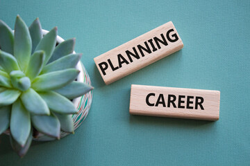 Planning Career symbol. Wooden blocks with words Planning Career. Beautiful grey green background...