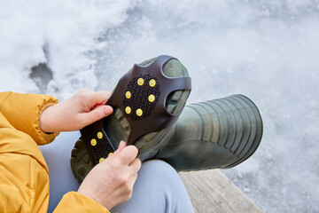 Crampons on rubber pad, ice grips for footwear, over boot attached traction cleats, 10 anti slip spikes.