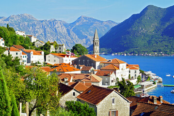 View of the Montenegrin city of Perast: the old houses of the city and the famous bell tower of the...