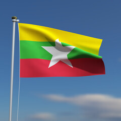 Burma Flag is waving in front of a blue sky with blurred clouds in the background