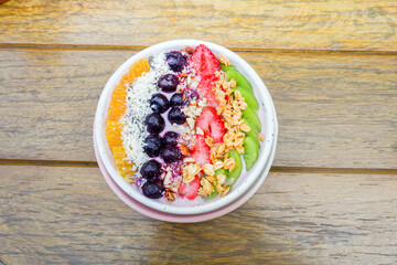 Healthy and colorful Breakfast Acai smoothie bowl with blueberries,kiwi fruit,chia seeds and...