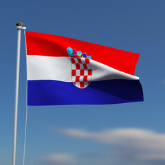Croatia Flag is waving in front of a blue sky with blurred clouds in the background