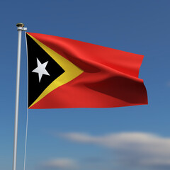 East Timor Flag is waving in front of a blue sky with blurred clouds in the background