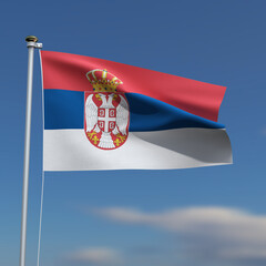 Serbia Flag is waving in front of a blue sky with blurred clouds in the background