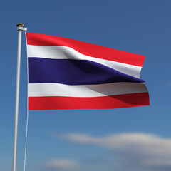 Thailand Flag is waving in front of a blue sky with blurred clouds in the background