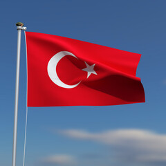 Turkey Flag is waving in front of a blue sky with blurred clouds in the background
