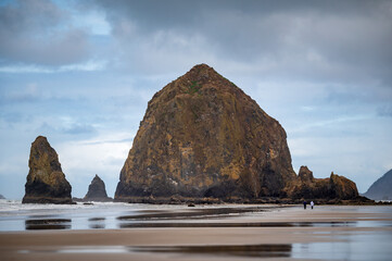 Haystack Rock is a 235 ft-tall sea stack in Cannon Beach, Oregon.  Haystack Rock is one of Oregon’s most recognizable landmarks, home to colorful tidepools and diverse birdlife. 