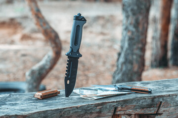 Adventure kit,hunting knife, map, compass, harmonica.