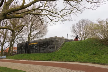 Fototapeten Fortifications and bunkers from the Napoleonic era in the Dutch fort known as Dirks Admiraal in Den Helder on a cloudy, rainy spring day © were