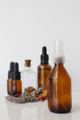 Obraz na płótnie Canvas essential oils in brown bottles