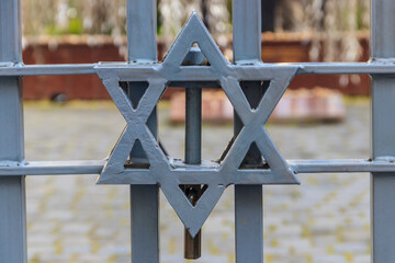 Jewish star of David on the metal fence