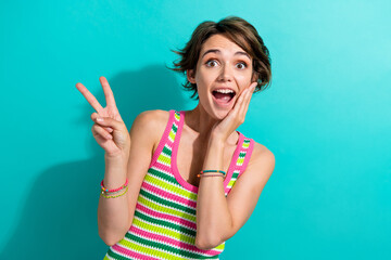 Portrait of excited funny lady person showing v sign symbol open mouth hand on cheek wear singlet...