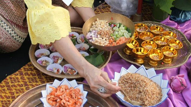 Making Miang Kham (traditional Southeast Asian herbal snack from Thailand and Laos), Traditional Thai snack. It&rsquo;s a snack containing different ingredients of herbs and vegetables. 