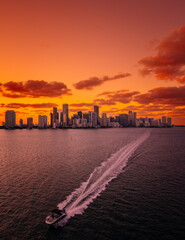 sunset in the city boat sea miami Florida skyline Brickell downtown orange 