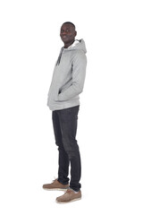 side view of man standing looking at camera and hands on pockets white bacground - 788736923