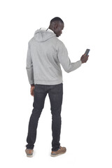 back view of a man holding a smartphone on white background