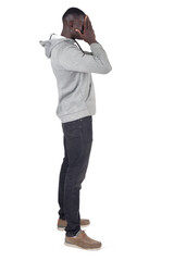 side view of a man covering her face with her hand on white background