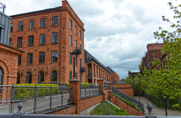 Revitalised buildings of the former factory, which were converted into lofts, adjacent to the...