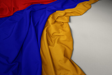 waving national flag of armenia on a gray background.