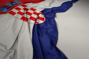 waving national flag of croatia on a gray background.