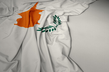 waving national flag of cyprus on a gray background.