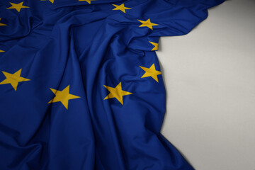 waving national flag of european union on a gray background.