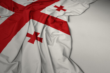 waving national flag of georgia on a gray background.