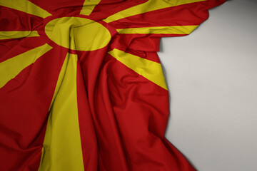 waving national flag of macedonia on a gray background.
