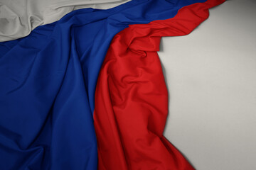 waving national flag of russia on a gray background.