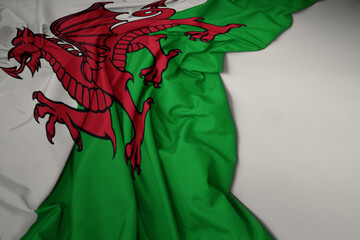waving national flag of wales on a gray background.