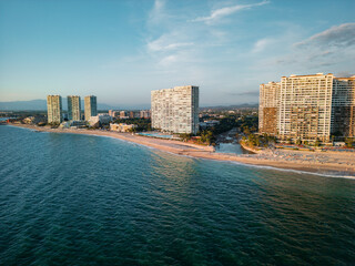 Aerial view at sunset of Peninsula Puerto Vallarta in the Hotel Zone near Playa de Oro in Jalisco Mexico.