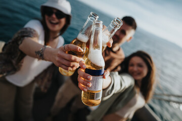 Group of friends toasting beers during a leisurely boat ride on a lake, capturing a moment of...