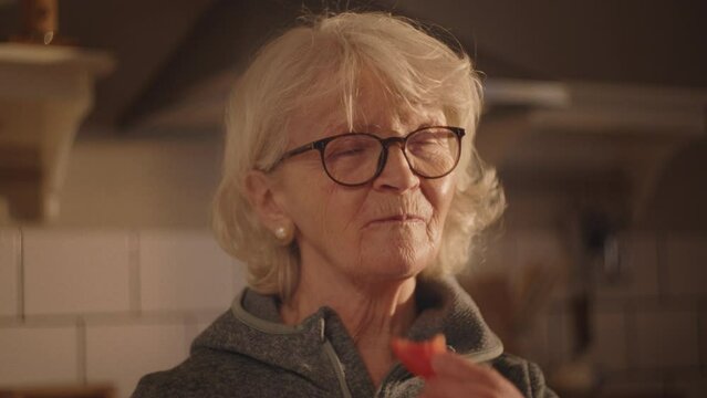 Eating strawberries, washing and preparing vegetables in the kitchen