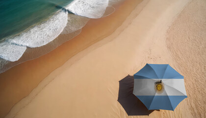 An aerial vista of a sandy beach with gentle ocean waves, featuring a beach umbrella adorned with the Argentina flag. Ideal for Argentina tourists seeking seaside relaxation