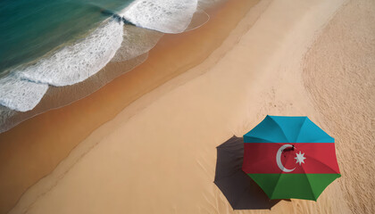 An aerial vista of a sandy beach with gentle ocean waves, featuring a beach umbrella adorned with the Azerbaijan flag. Ideal for Azerbaijan tourists seeking seaside relaxation
