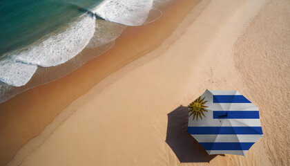 An aerial vista of a sandy beach with gentle ocean waves, featuring a beach umbrella adorned with the Uruguay flag. Ideal for Uruguay tourists seeking seaside relaxation