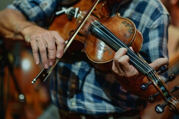 Fototapeta premium A man passionately plays the violin in a warmly lit room, his fingers dancing across the strings as music fills the space.