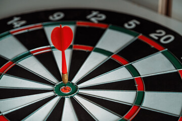 Concept of challenge in business marketing bullseye and intelligent customer reaching. The dart is...