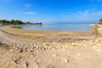 The small bay at the base of the Tylos Fort and Karbabad Beach, with a fresh water spring in the sea, in Manama, Bahrain.