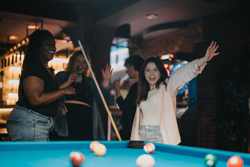 A group of friends enjoying a fun-filled evening playing billiards in a cozy bar setting, sharing laughs and good times together.
