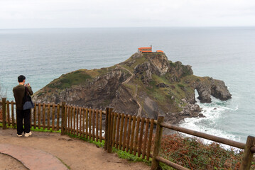 Panoramic view of San Juan de Gaztelugatxe, a small hermitage located in the middle of the sea on...