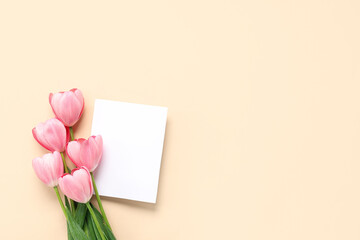 Blank card with beautiful pink tulips on beige background. Mother's Day celebration