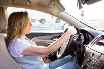 Confident Woman Driving Her Car on a Sunny Day