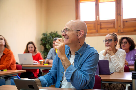 Lifelong learning concept with senior adult in class