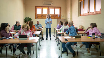 Senior adults engaging in classroom learning