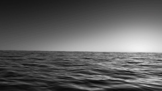 3d render video of black and white seascape with a distant horizon. The sun's rays faintly illuminate a dark, textured ocean, creating a moody monochrome landscape that evokes mystery and depth