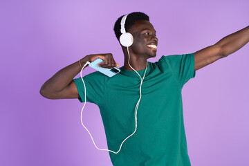 Man Wearing Headphones and Green Shirt