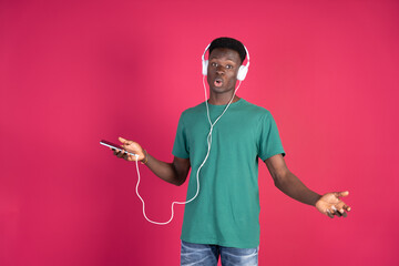 Man Wearing Headphones Holding Cell Phone